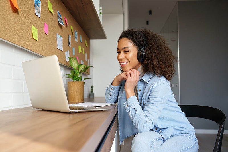 woman looking on laptop for protection products